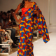 A model displays an outfit by designer Kil Fashion in Lagos